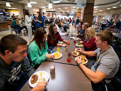 Students enjoy eating lunch in the cafeteria