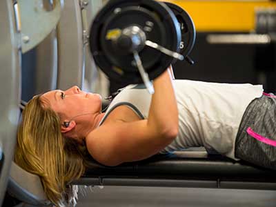 Student lifting weights