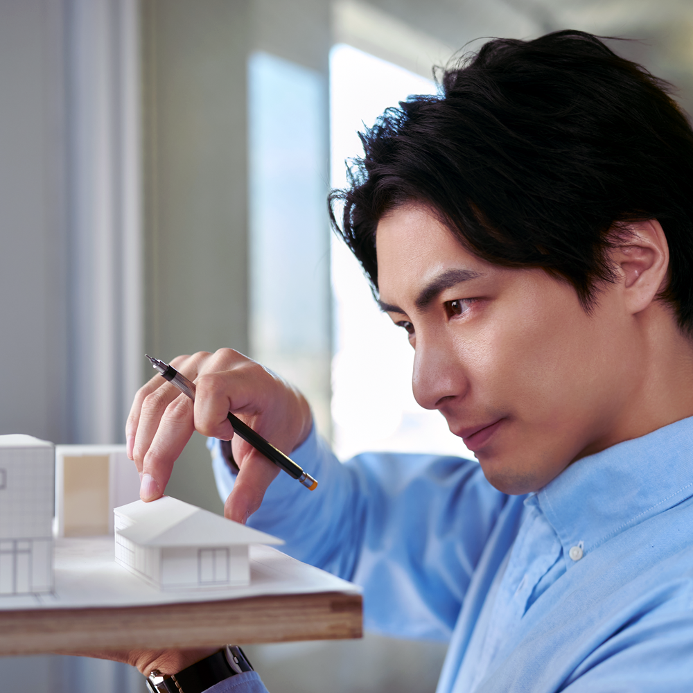 An architect looks over a design they created