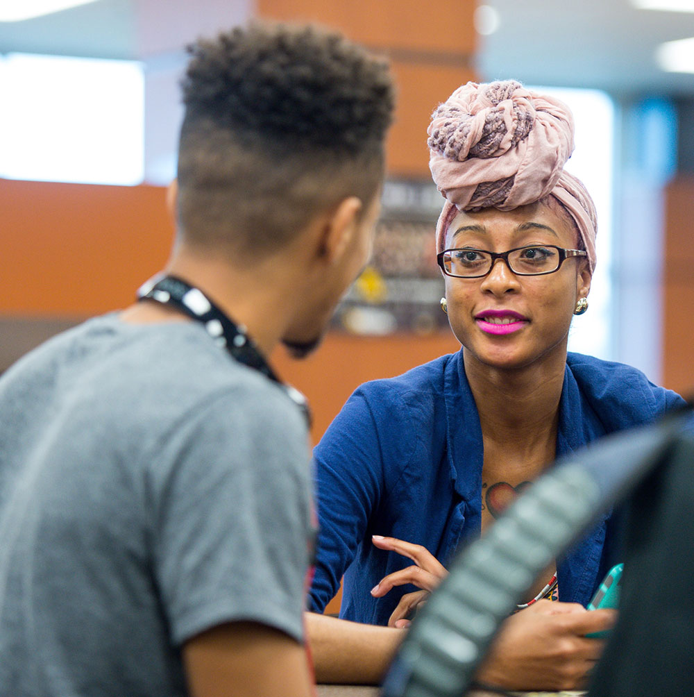 Admissions rep and student talking