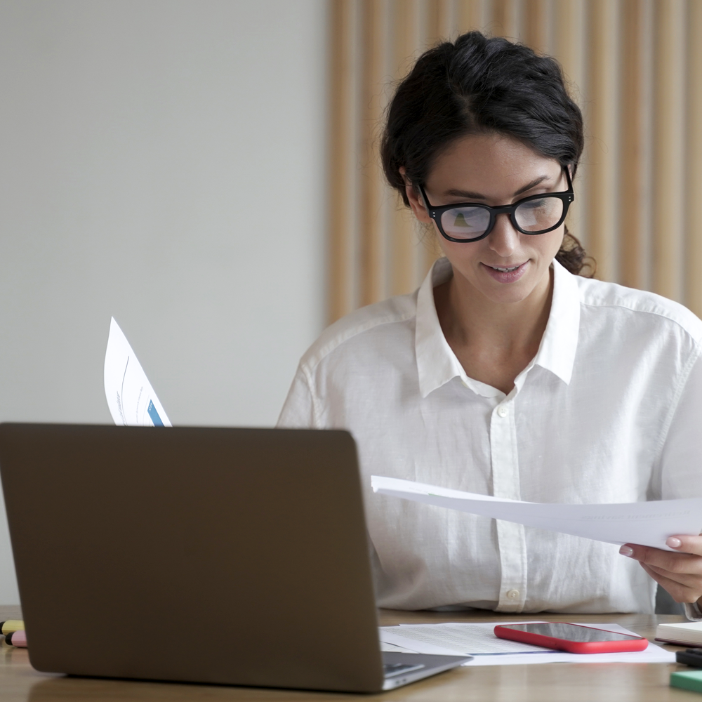 Medical Billing And Coding1 A woman works from home at her computer overlooking medical billing and coding.