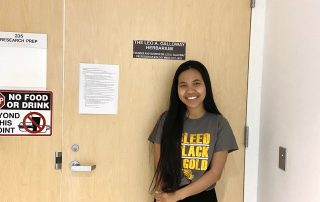 Student in front of Herbarium