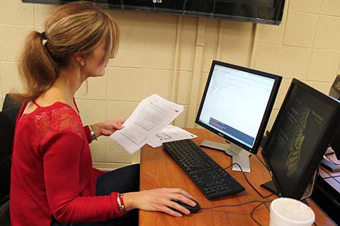 Finance student working on a computer