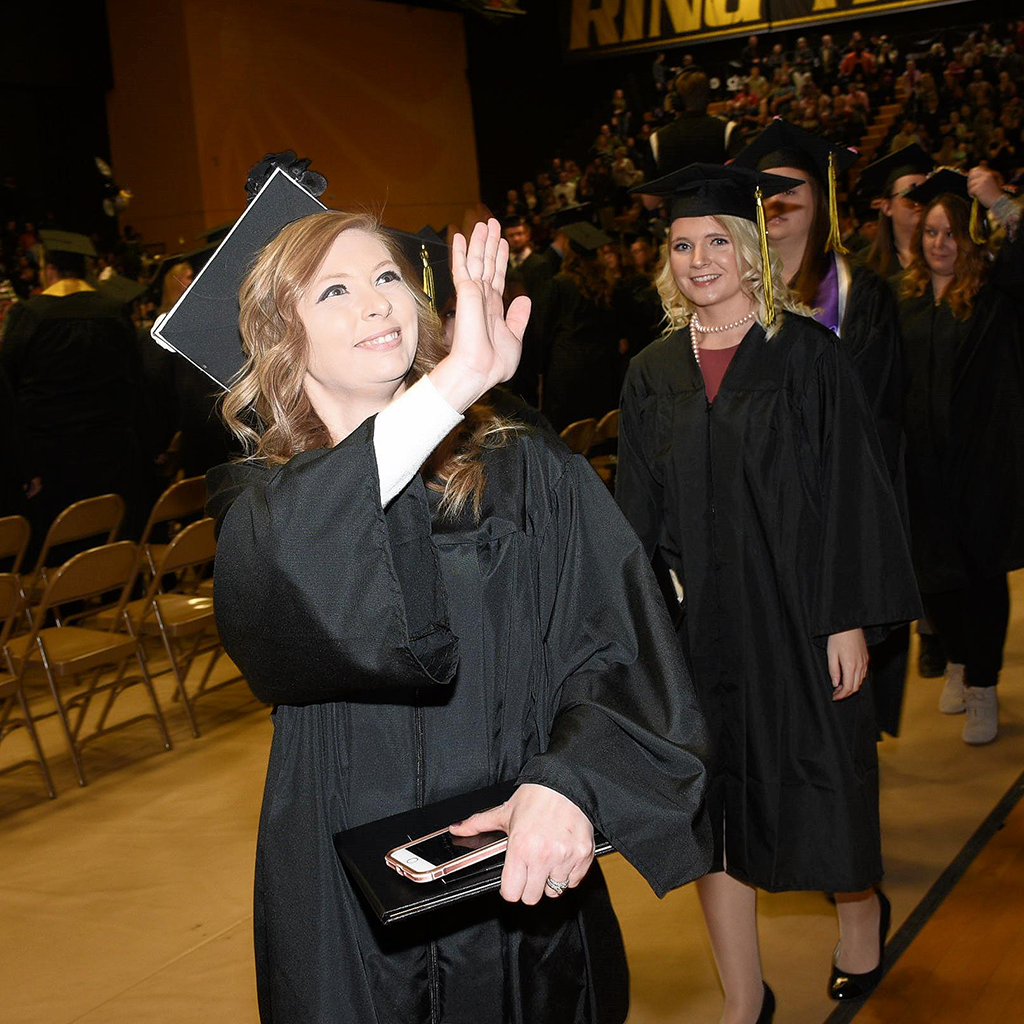 graduate waving