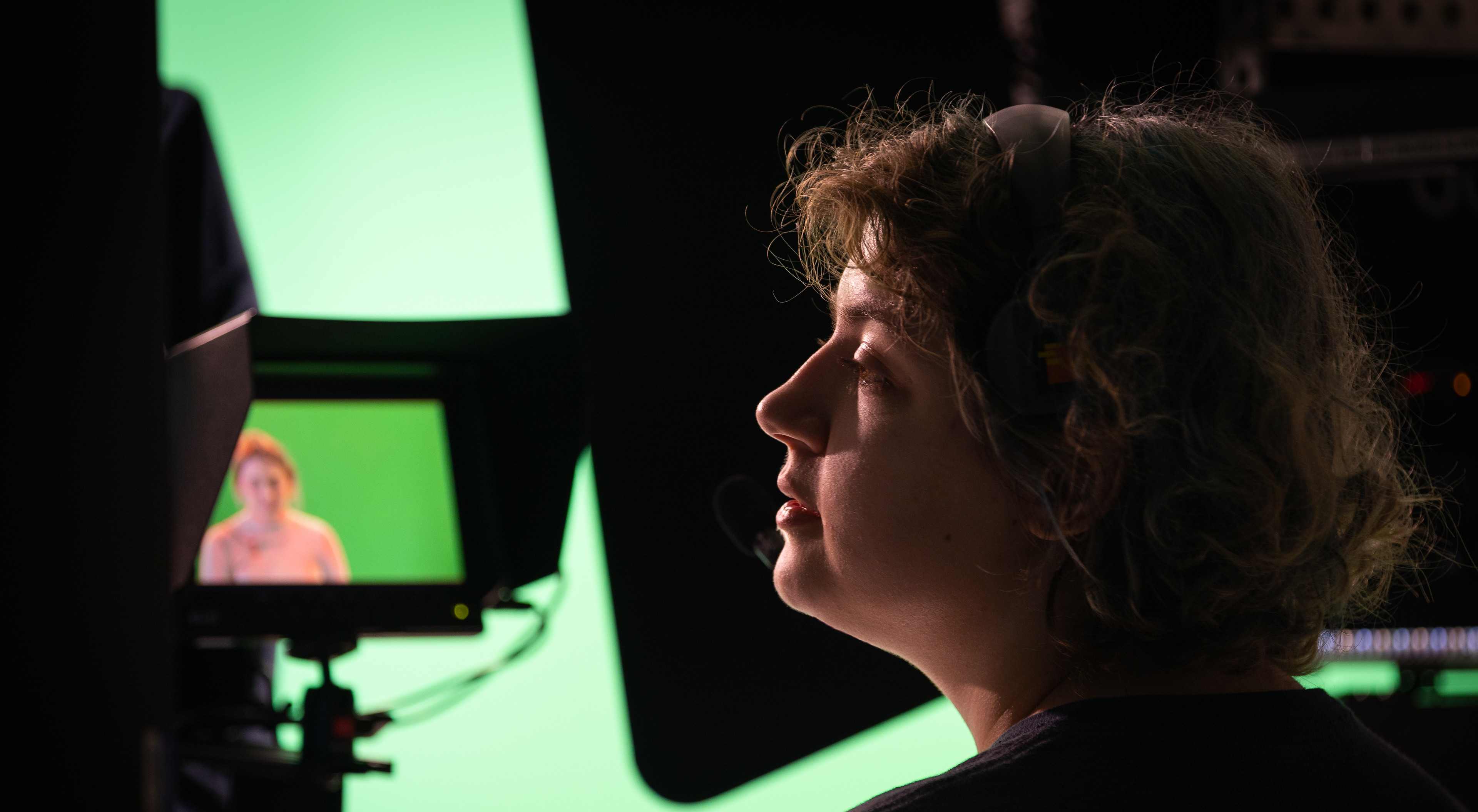 A student watches a broadcast through a camera viewer
