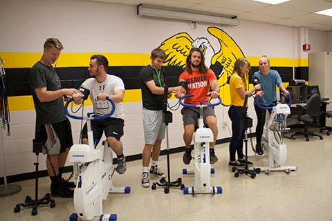 Students learn how to take blood pressure readings during a lab class