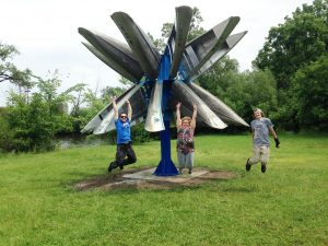 An entry from Missouri Western was one of four pieces of canoe-themed art that was installed in Ann Arbor, Michigan last summer. The Missouri Western entry, “Turbine,” won a public vote to be part of the Canoe Imagine Art installation. The entry was designed by students Heather Lafromboise, center; Jake Proffit, right; Neil Lawley, assistant professor of art and director of sculpture, left; and construction professional Dustin Lafromboise, not pictured.