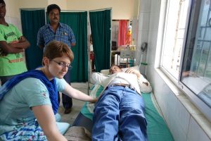 Crystal Coakley with a patient in India. 