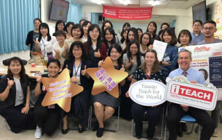 adrienne johnson in taiwan posing with an entire class for a photo