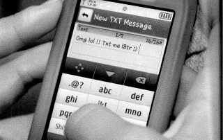 black and white image of a mid-2000s cell phone