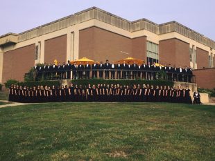 the Missouri Western Concert Chorale stands in front of Potter Hall