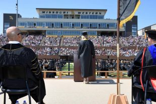student speaker addresses crowd at commencement ceremony