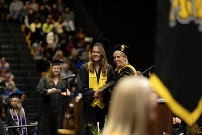 graduate congratulated by president
