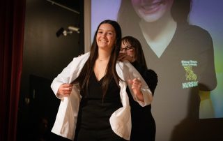nursing student receives white coat