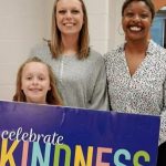 elementary student, parent and teacher celebrate kindness
