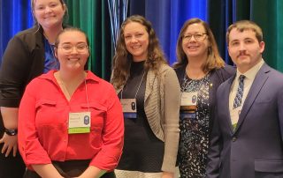 students and faculty at convention