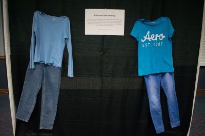 2 outfits of blue t-shirt and blue jeans against black backdrop