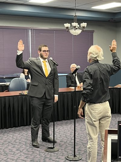 student governor takes oath of office in board room
