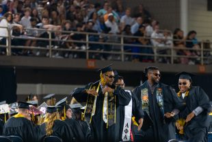 graduates dance in the aisle