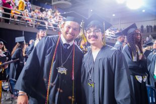 graduates smile after ceremony