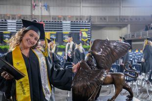 graduate rubs griffon for good luck