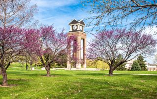 photo of MoWest clocktower with blooming trees