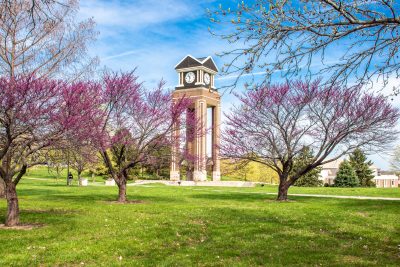 photo of MoWest clocktower with blooming trees