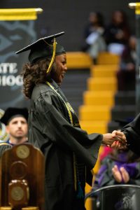 students shakes President's hand