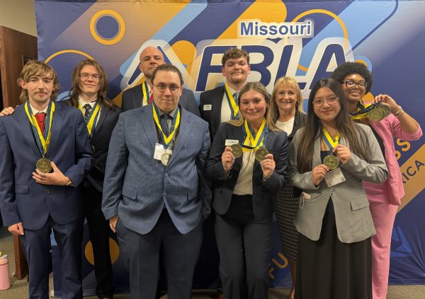 MoWest FBLA students and adviser with medals