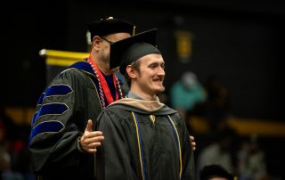 graduate student receives hood