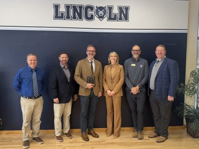 award winner and MoWest officials at celebration