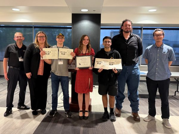 students and advisers with award certificates