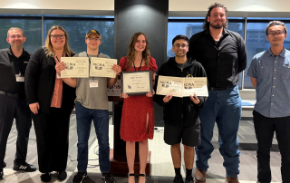 students and advisers with award certificates