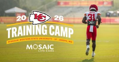 football player on practice field with training camp logo