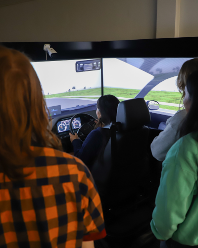 student behind the wheel of a police driving simulator