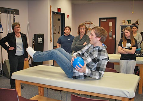 A Physical Therapist Assistant student tries a new exercise technique