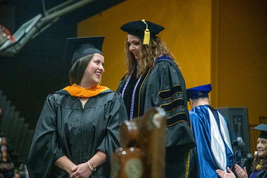 MSN student receives hood at commencement