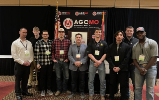 Students in front of AGC signage