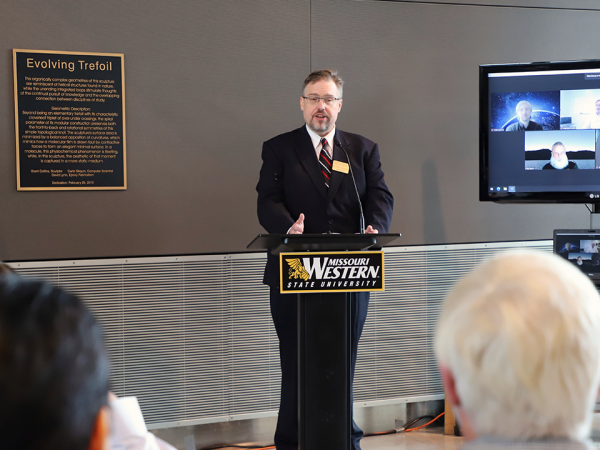 doctor jeffrey woodford at a podium