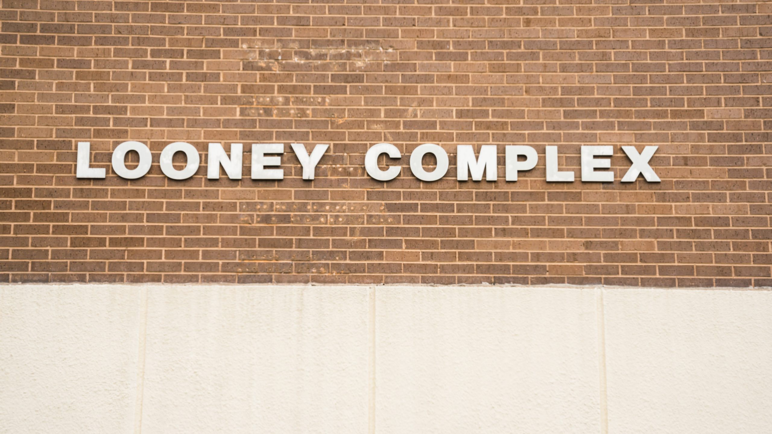 Looney Complex Front Sign