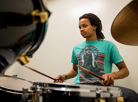 MWSU music major practices on the drums