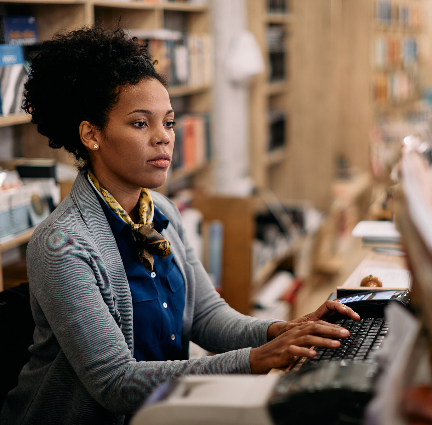 Librarian typing on a typewriter