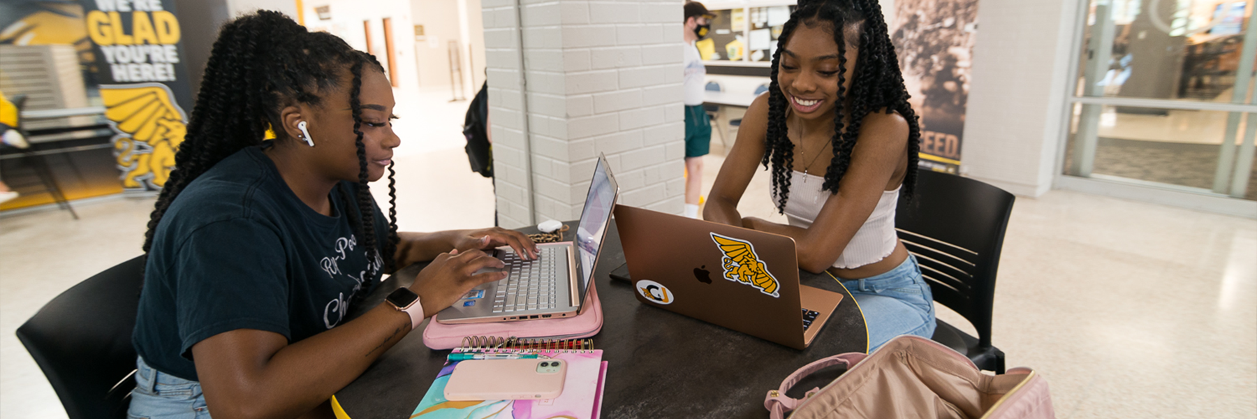 two students studying at a table