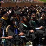 Graduates wait anxiously after receiving their diplomas