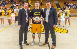 Left to right: Head coach Brett Weiberg, Cole Clearman and director of athletics Josh Looney